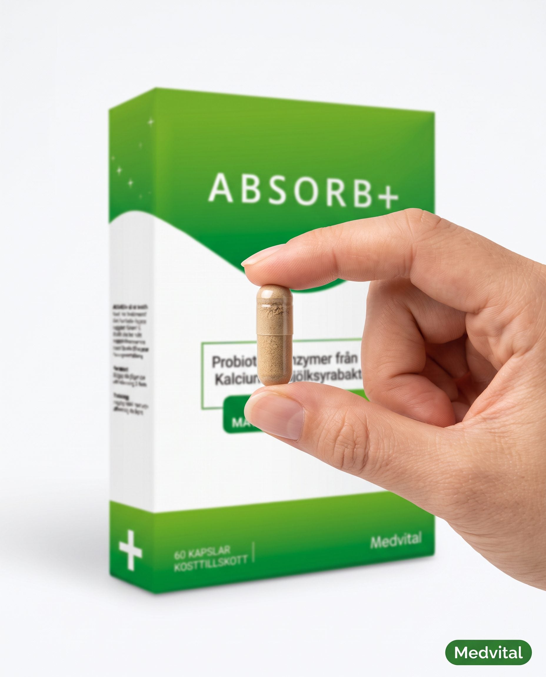 En hand håller en Absorb+-kapsel framför förpackningen